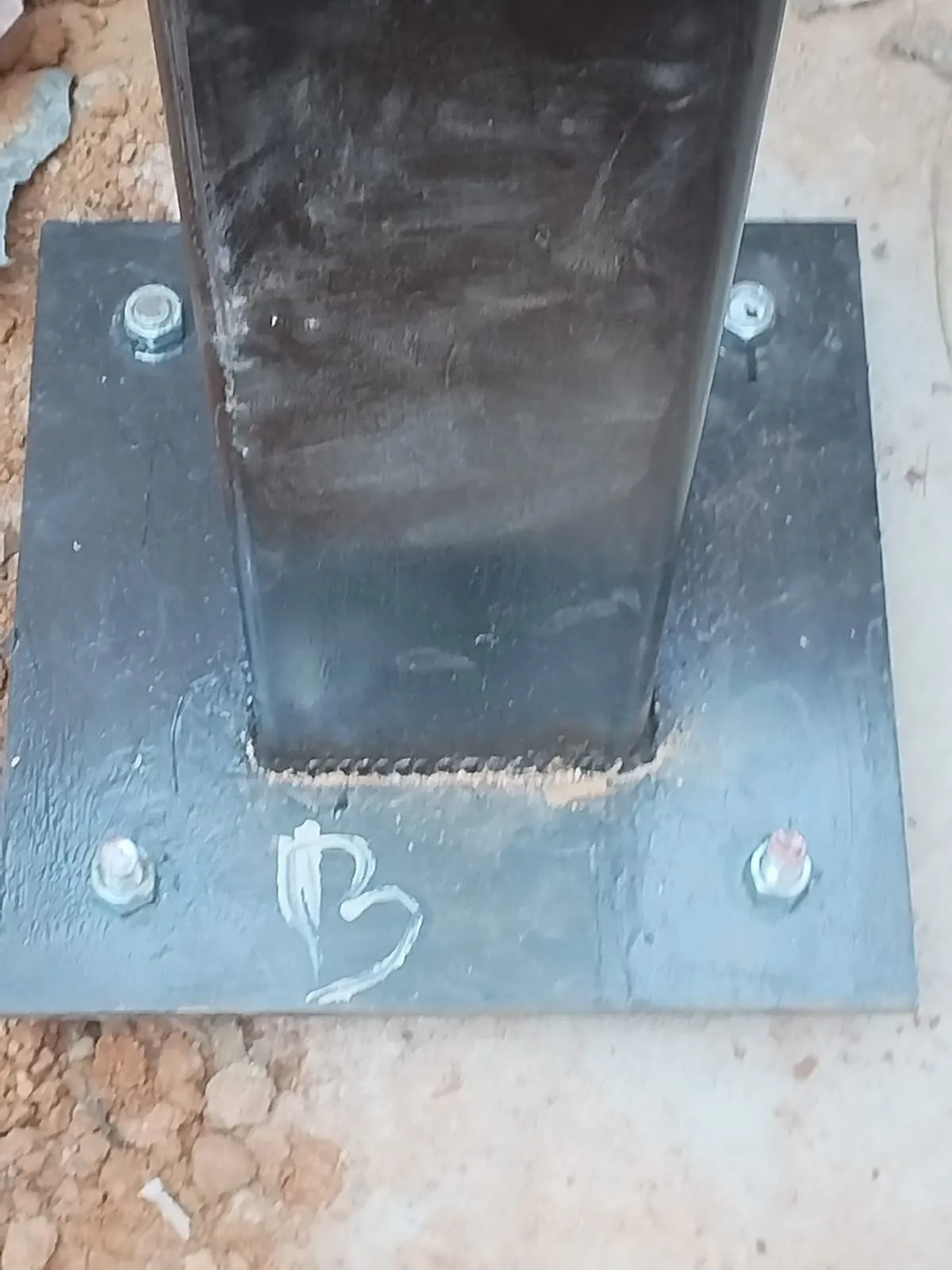 Close-up of a welded structural column base plate