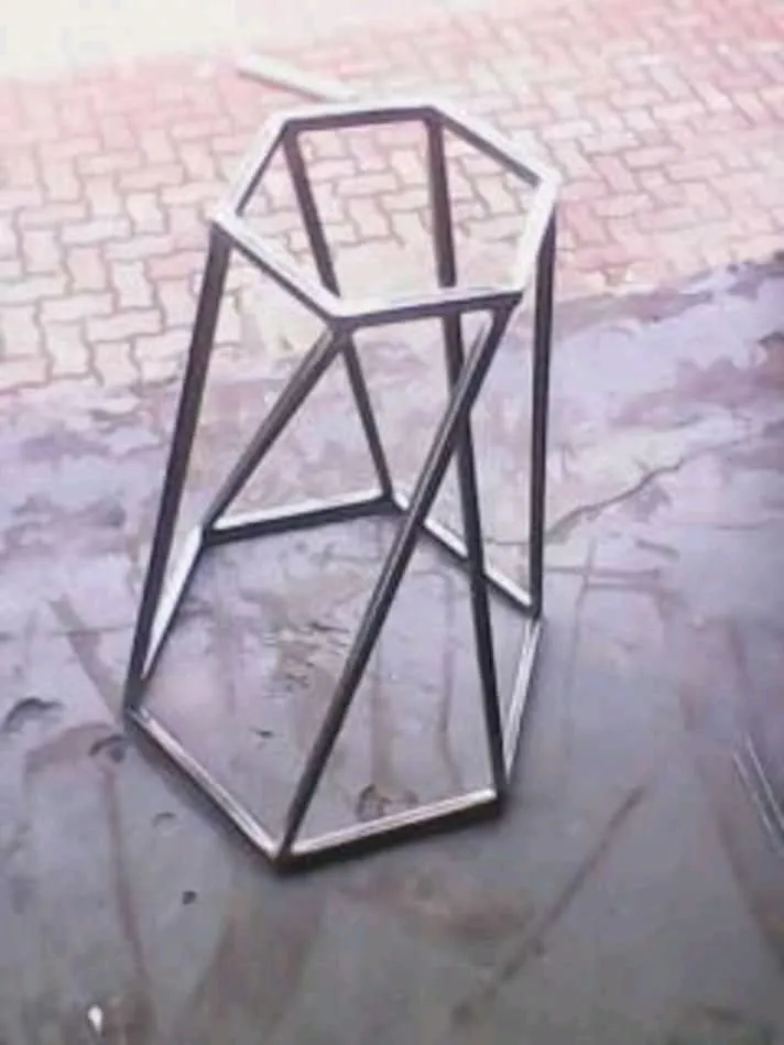 Hexagonal mild steel side table base with faceted, tapering legs
